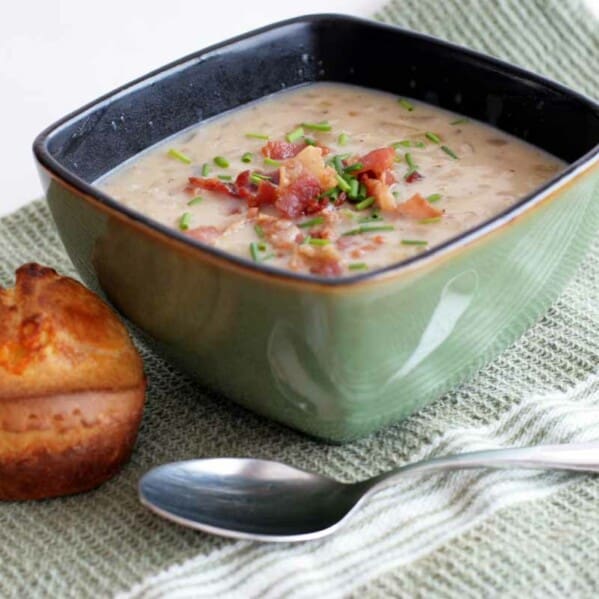 bowl of onion chowder with an onion popover on the side