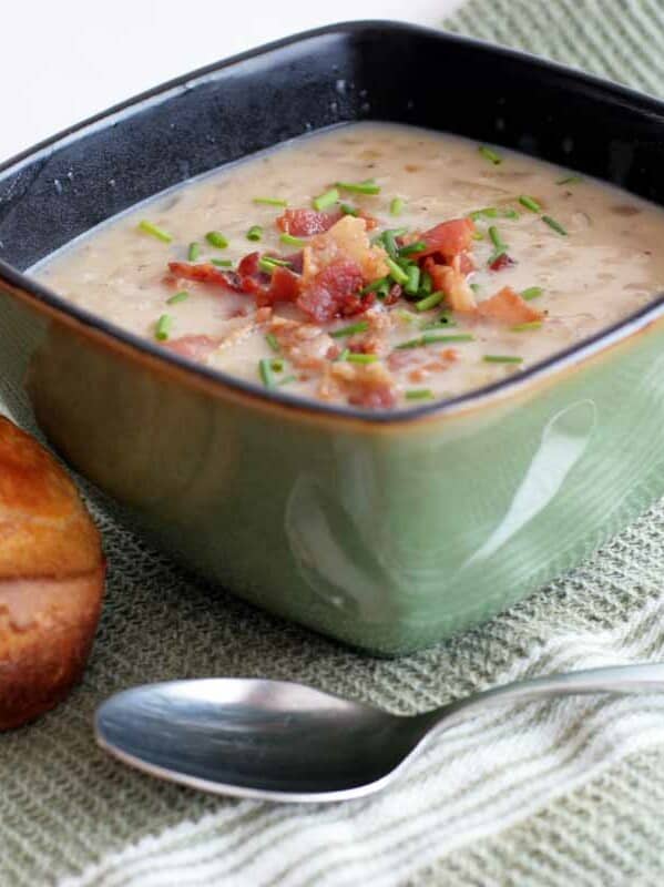 bowl of onion chowder with an onion popover on the side