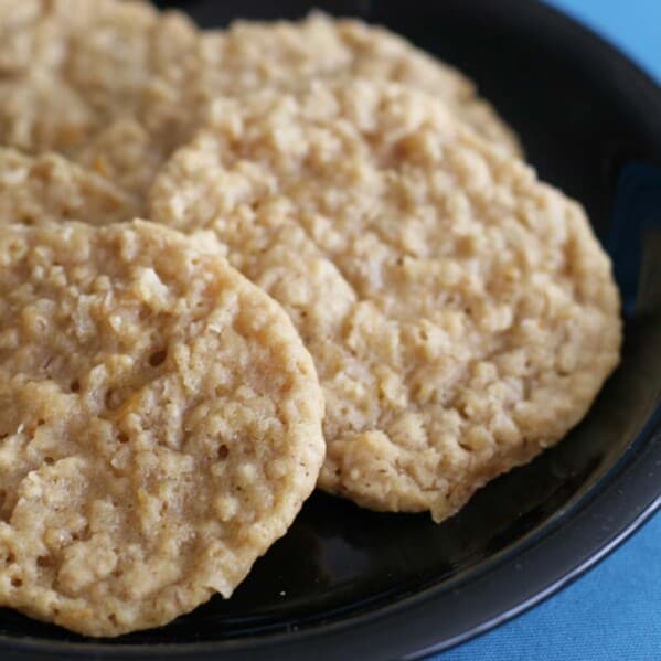 cookies with oats and orange on a black plate