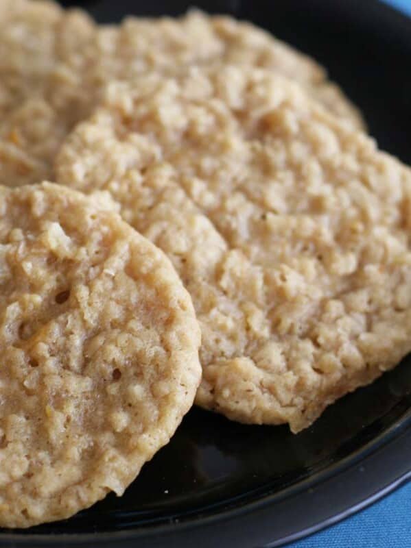 cookies with oats and orange on a black plate