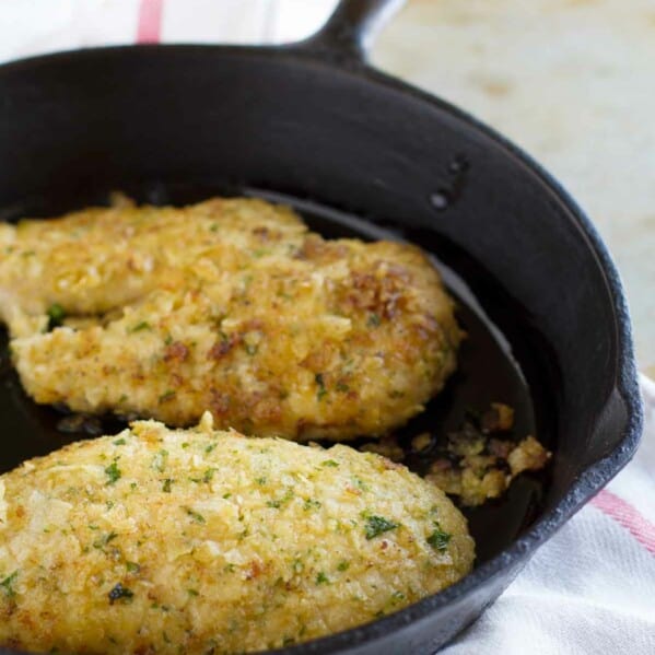 2 pieces of Potato Chip Chicken in a cast iron skillet