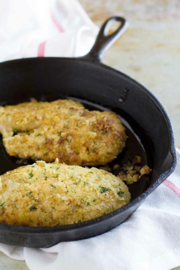 2 pieces of Potato Chip Chicken in a cast iron skillet