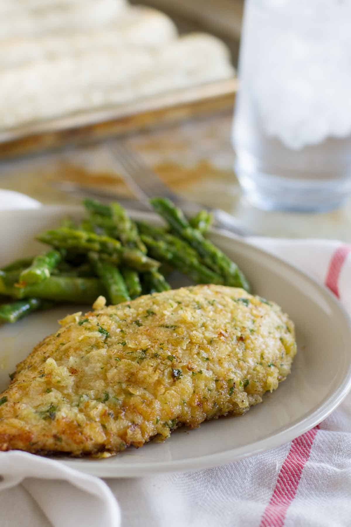 Potato Chip Chicken on a plate with asparagus