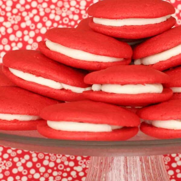 stack of red velvet whoopie pies on a cake stand