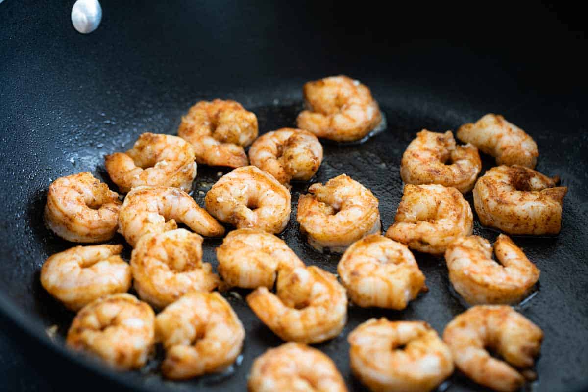 cajun spiced shrimp cooking in a skillet