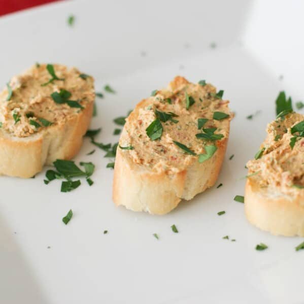 Sun-Dried Tomato Goat Cheese Spread on bread slices