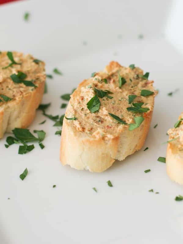 Sun-Dried Tomato Goat Cheese Spread on bread slices