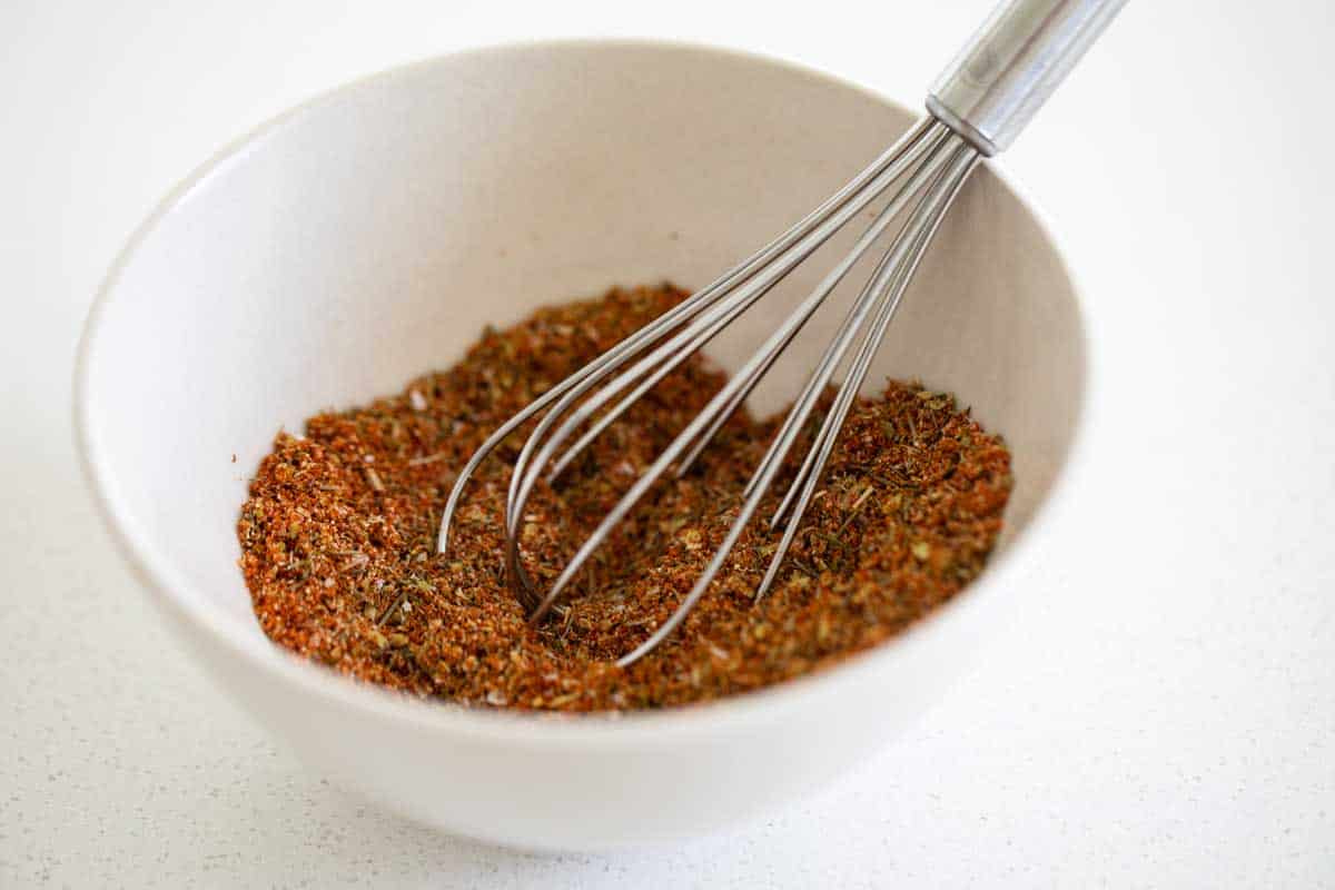 homemade grilled chicken seasoning with a whisk