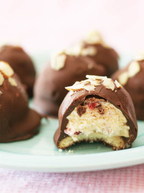 Ice Cream Bonbons - cookies topped with ice cream and covered in chocolate on a plate