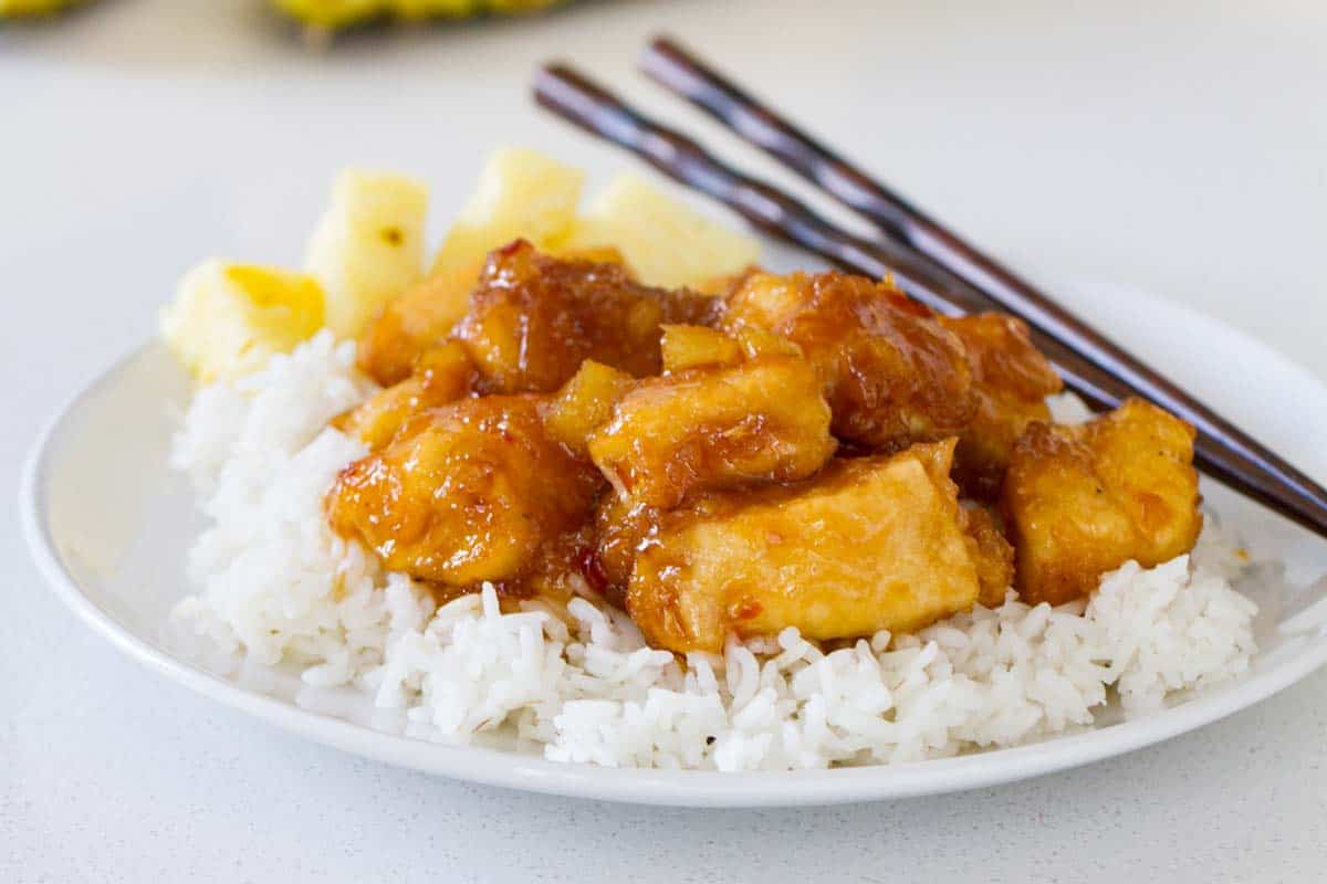 Pineapple Chicken with chopsticks and rice