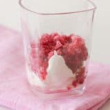 Pomegranate Granita with whipped cream in a cup