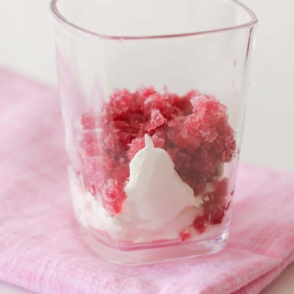 Pomegranate Granita with whipped cream in a cup
