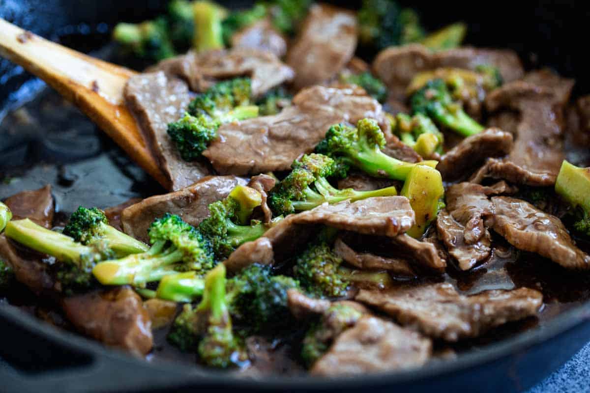 Making beef and broccoli in a cast iron pan