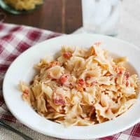 pasta with tomatoes and bacon in a bowl