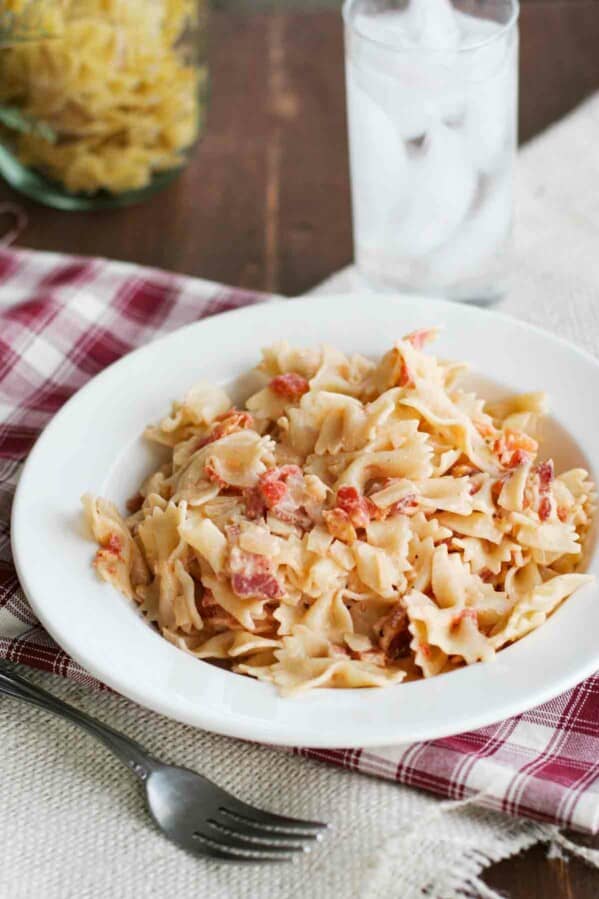 pasta with tomatoes and bacon in a bowl