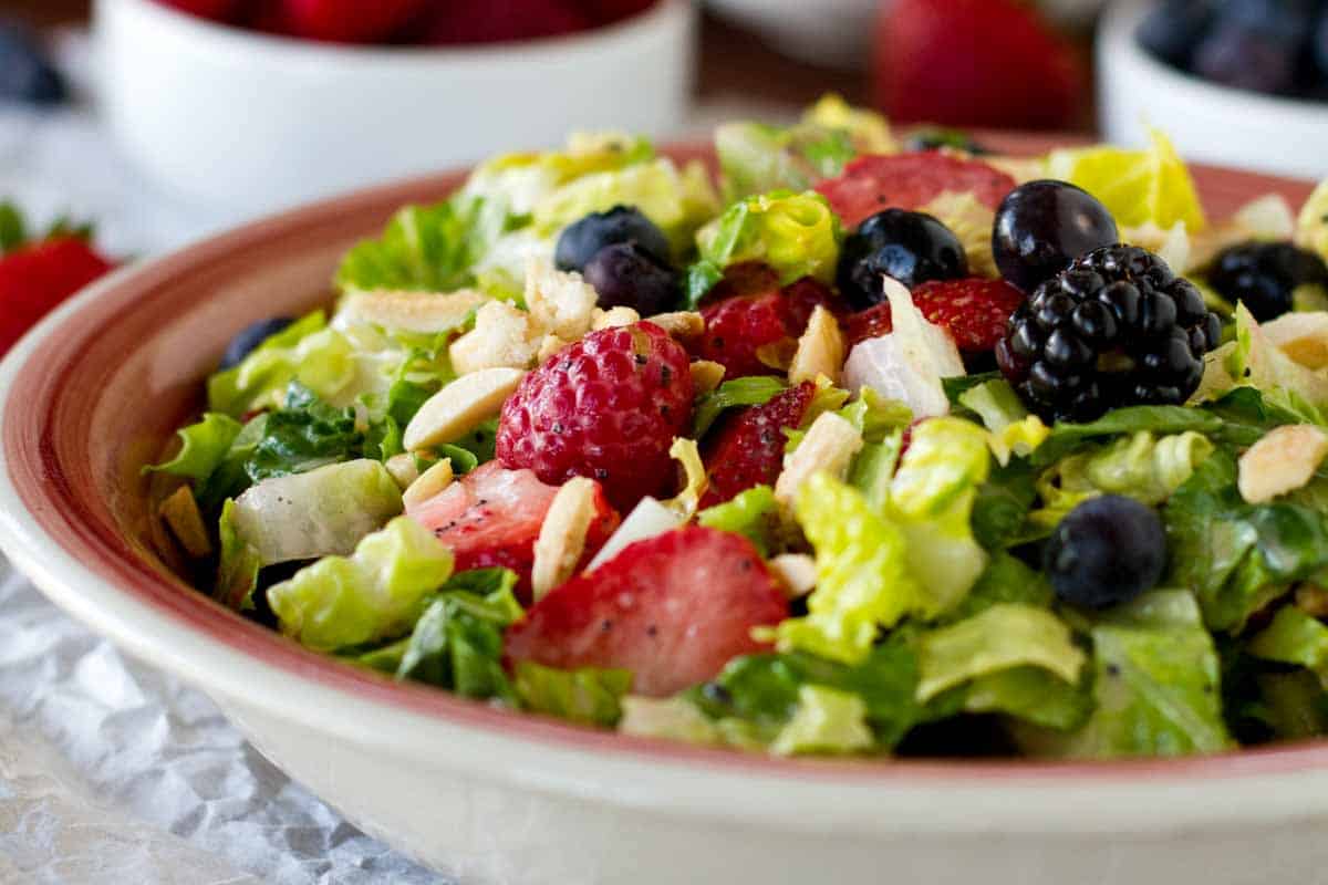 Chopped Salad with Berries and Nuts in a Bowl