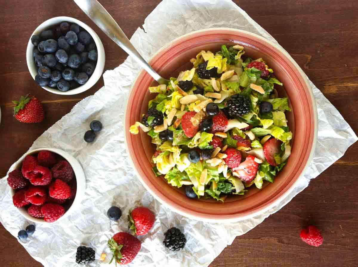 overhead view of summer chopped salad with berries