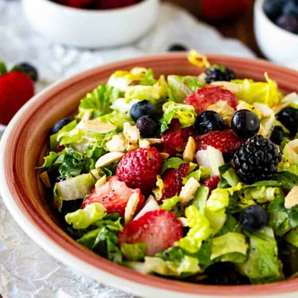 Chopped Salad with summer berries, nuts and homemade poppy seed dressing
