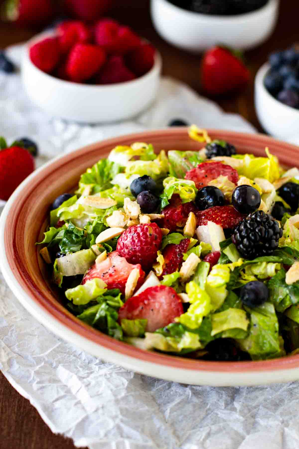 Chopped Salad with summer berries, nuts and homemade poppy seed dressing