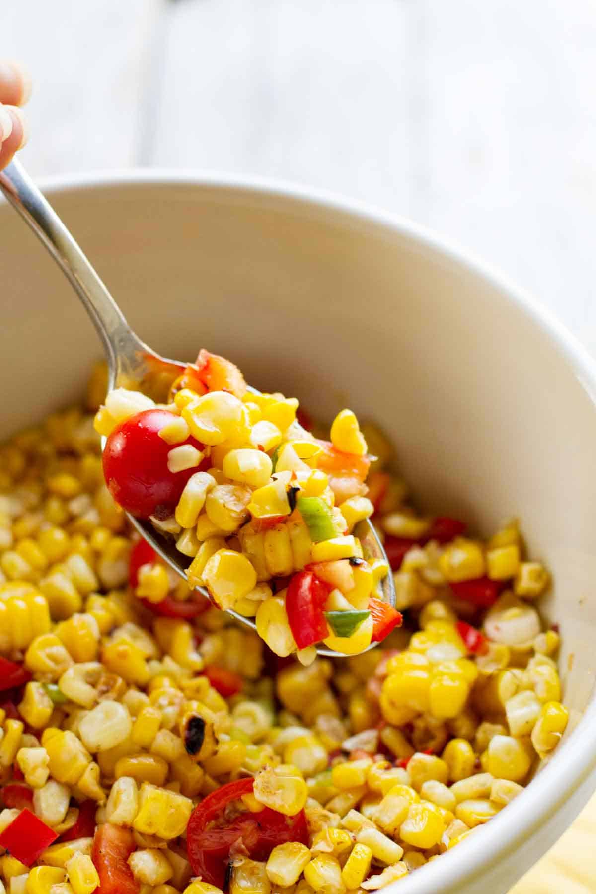 spoonful of grilled corn salad