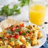 plate with scrambled eggs made with sweet potatoes and Mexican flavors