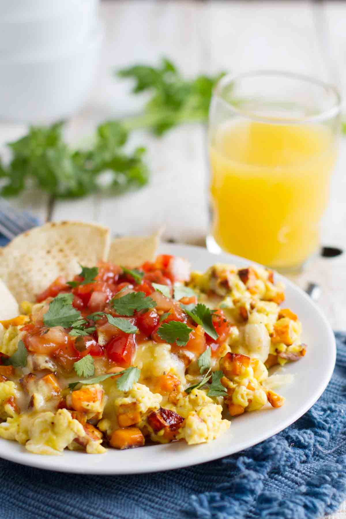 plate with scrambled eggs made with sweet potatoes and Mexican flavors