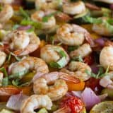 chopped vegetables and shrimp cooked on a sheet pan