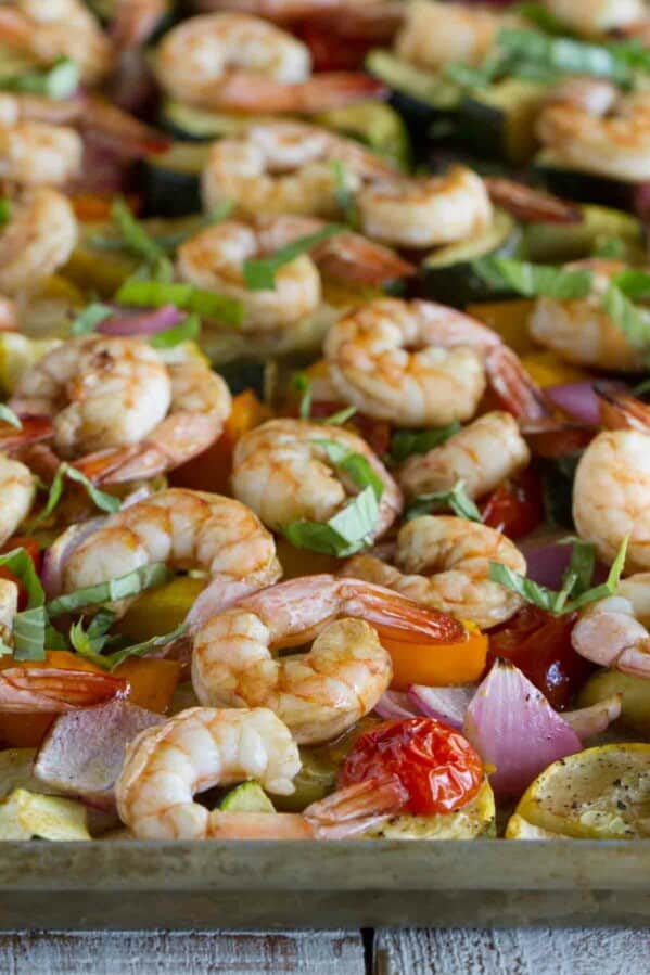 chopped vegetables and shrimp cooked on a sheet pan