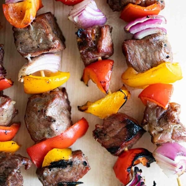 steak, peppers and onions on a skewer, cooked and charred