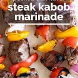 close up of steak kabobs with text overlay