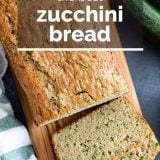 overhead view of sliced zucchini bread on a cutting board