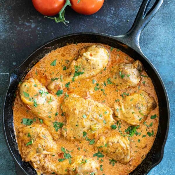 overhead view of chicken paprikash sprinkled with parsley