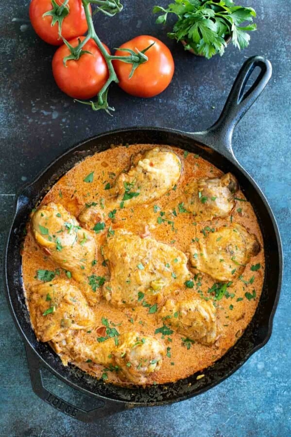 overhead view of chicken paprikash sprinkled with parsley