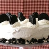 Cookies and Cream Cake with whole cookies on top with a red background