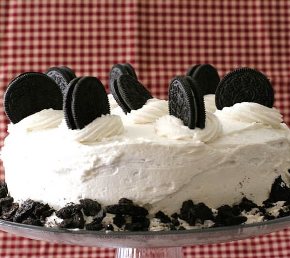 Cookies and Cream Cake with whole cookies on top with a red background