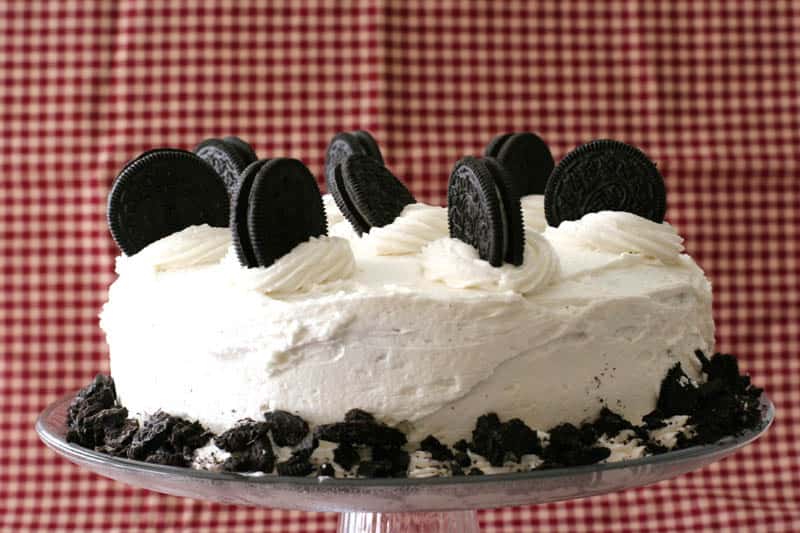 Cookies and Cream Cake with whole cookies on top with a red background