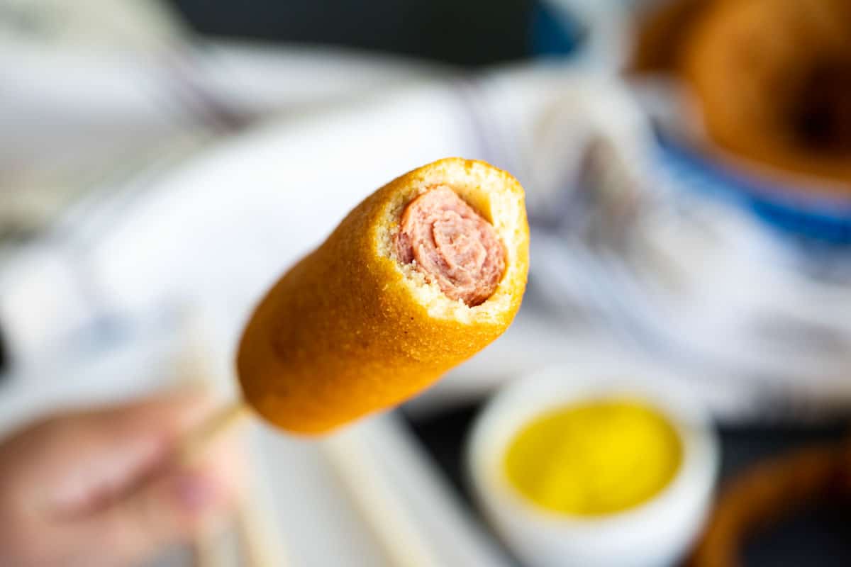 Corn Dog with a bite taken out of it