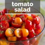 tomato salad with olive oil and herbs in a bowl