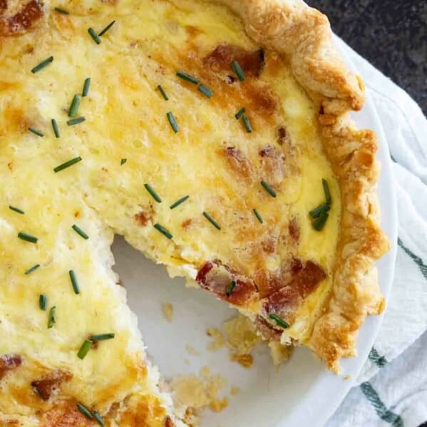 overhead view of quiche lorraine with one slice cut out
