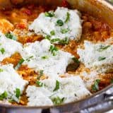 pan with Skillet Lasagna topped with ricotta and basil