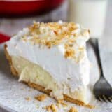 plate with slice of coconut cream pie