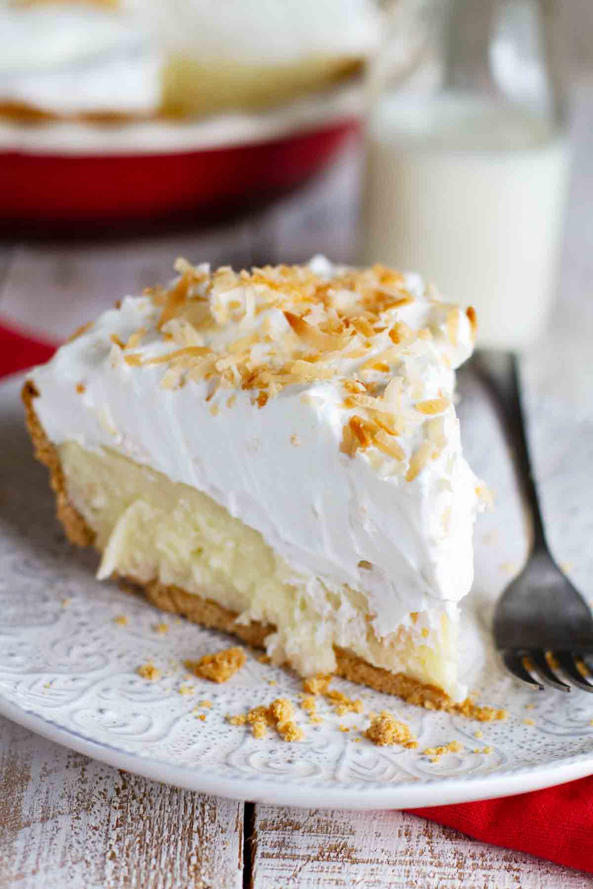 plate with slice of coconut cream pie