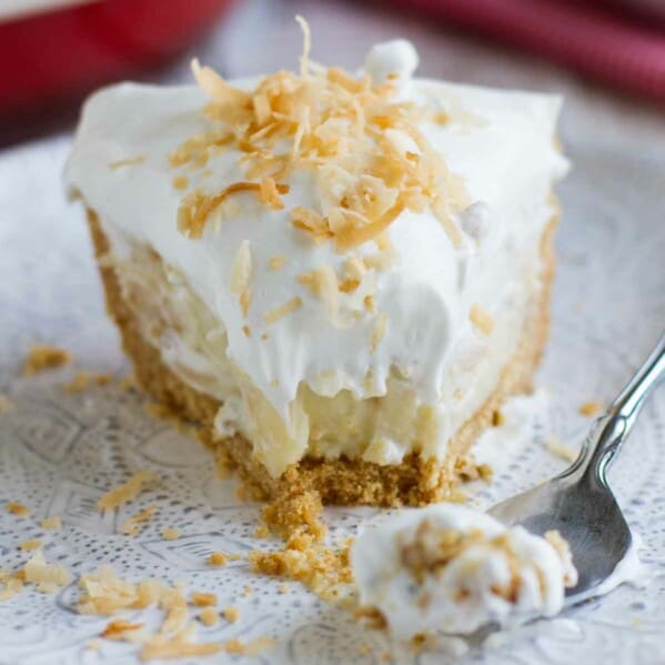 fork with bite of coconut cream pie