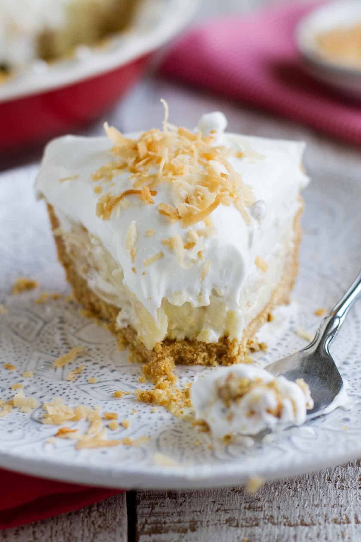 fork with bite of coconut cream pie