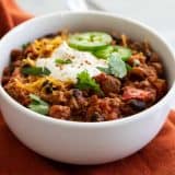 bowl of slow cooker pumpkin chili with toppings
