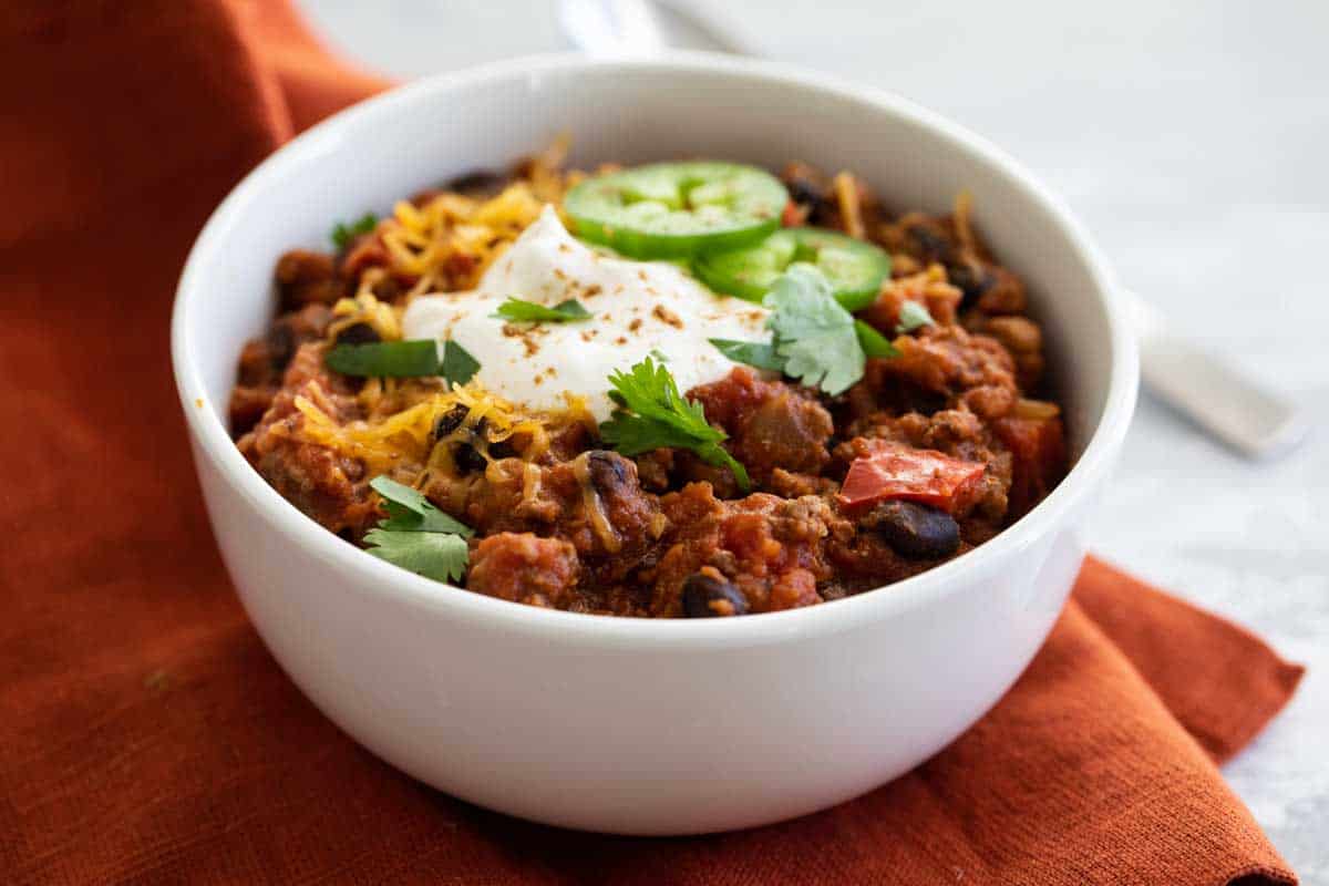 bowl of slow cooker pumpkin chili with toppings
