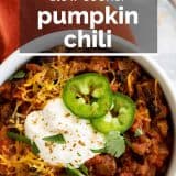 bowl of pumpkin chili with text overlay