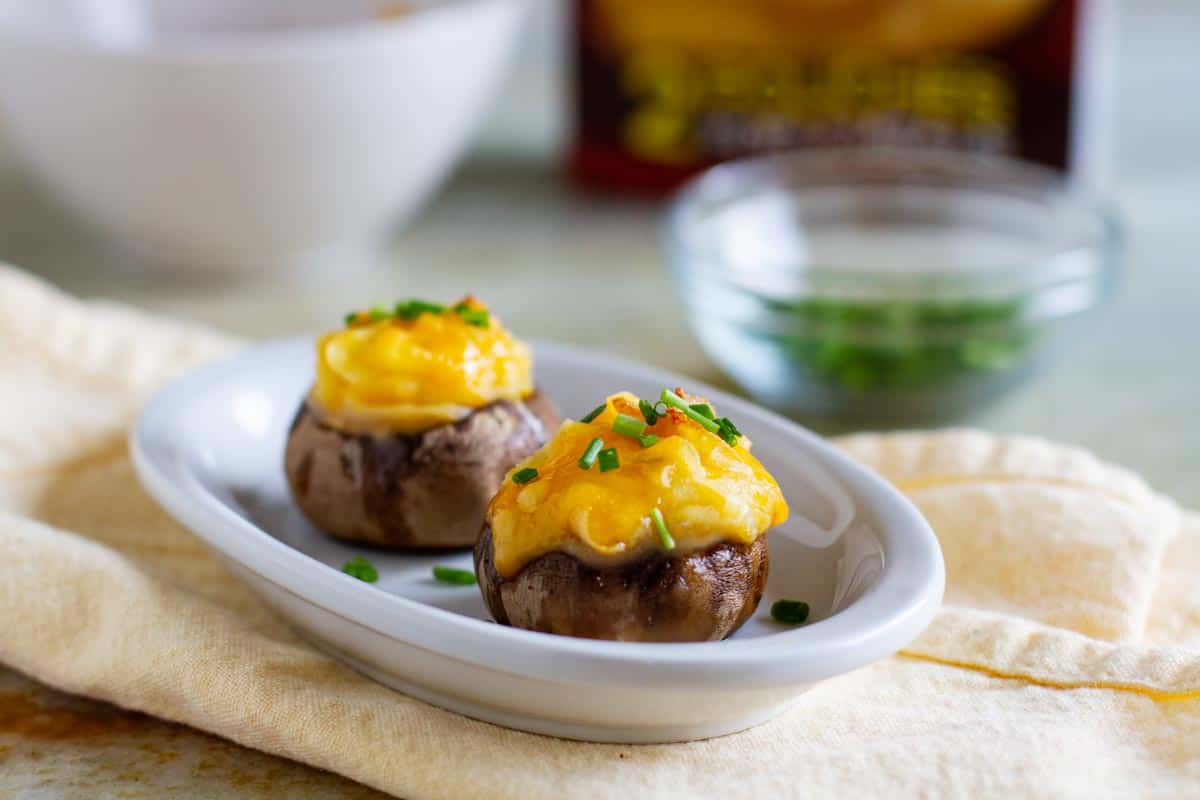 plate with two cheesy mashed potato stuffed mushrooms