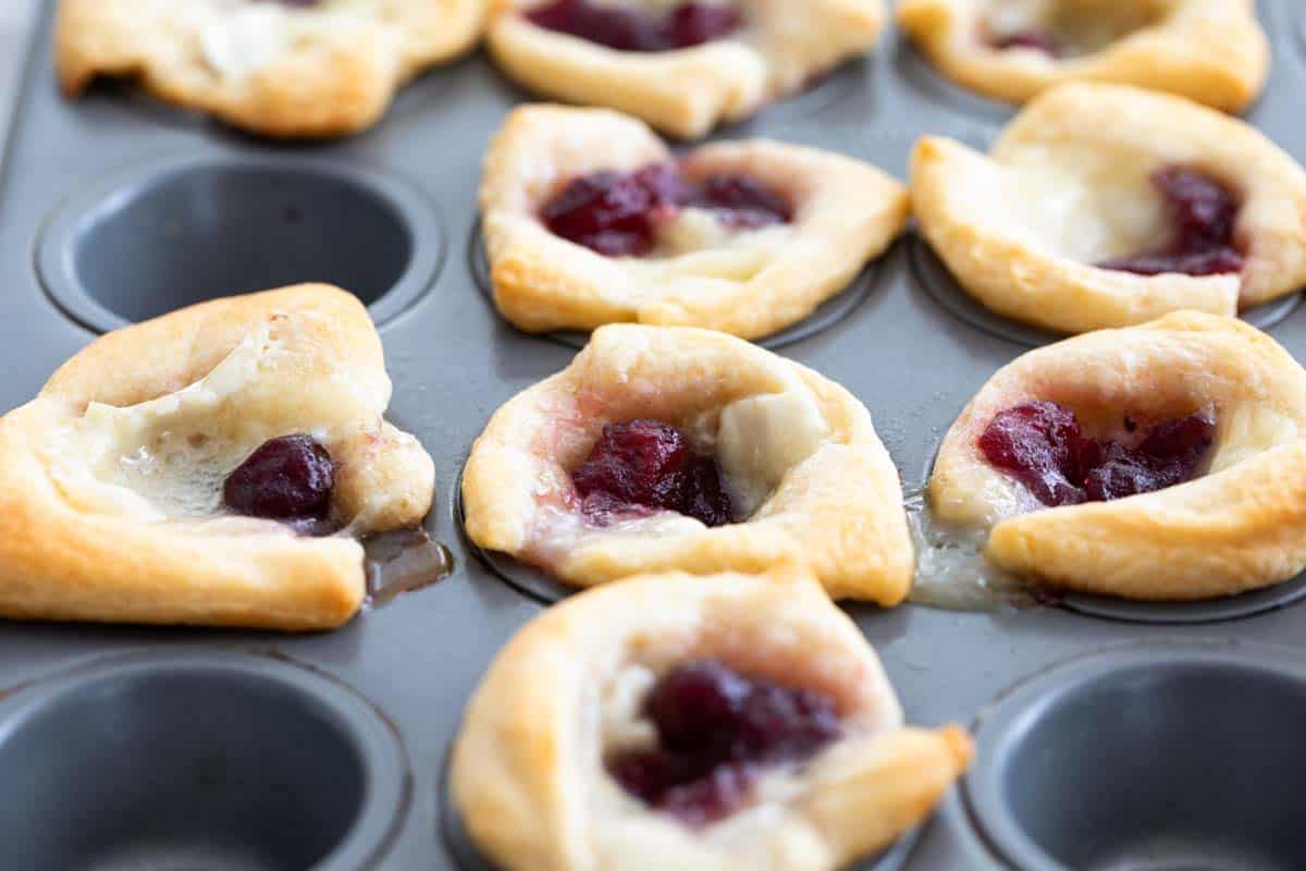 cranberry brie bites in a muffin tin