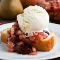 Cranberry Sauce over Pound Cake with ice cream on a plate